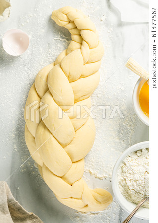 Making traditional jewish challah bread on marble background 61377562