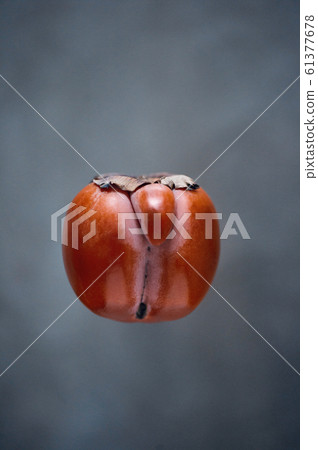Orange ugly persimmon flying kaki fruit isolated 61377678