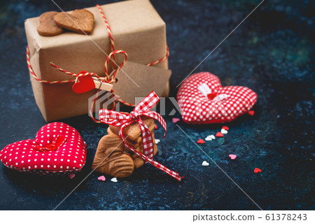 Gift box with and cookies in the shape of heart. Gift box with and cookies in the shape of heart. 61378243