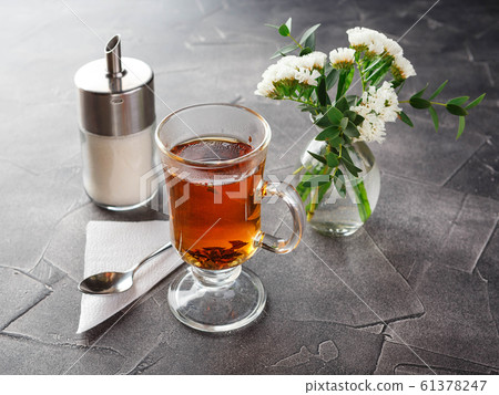 Glass cup of black tea, tea ceremony Glass cup of black tea, tea ceremony 61378247