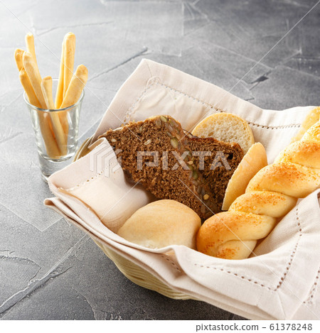 Basket of bread on the table Basket of bread on the table 61378248