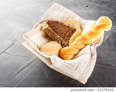 Basket of bread on the table Basket of bread on the table 61378249