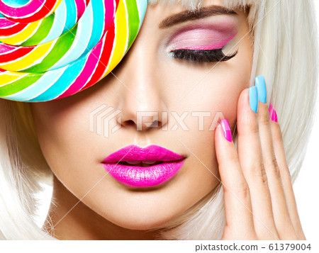 Face of a beautiful  girl with pink eye make-up 61379004
