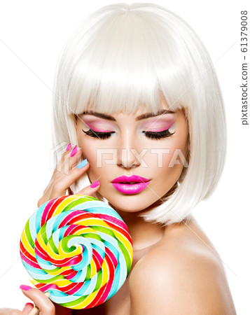 Face of a beautiful  girl with pink eye make-up 61379008