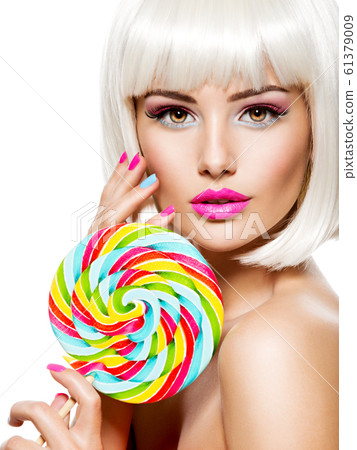 Face of a beautiful  girl with pink eye make-up 61379009