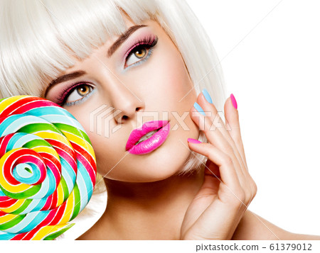 Face of a beautiful  girl with pink eye make-up 61379012