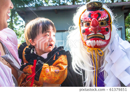 Boy surprised by tengu at festival 61379851