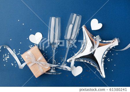 wineglasses and gift box on classic blue 61380241
