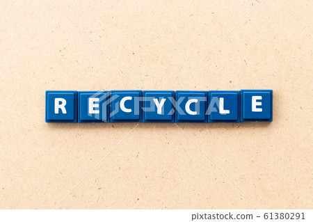 Tile letter in word recycle on wood background 61380291