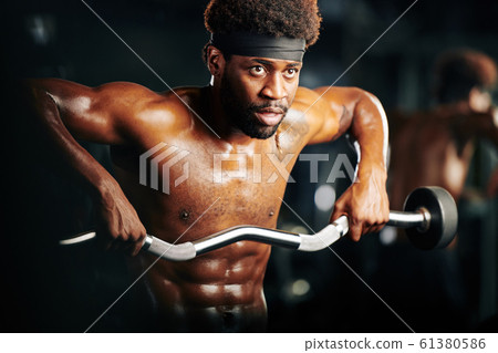 Strong Man Doing Weightlifting Exercise Strong Man Doing Weightlifting Exercise 61380586