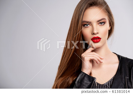 Portrait of beautiful young woman with bright 61381014