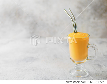 Yellow milkshake with metal straws, sopy space Yellow milkshake with metal straws, sopy space 61381724