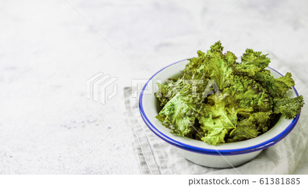 Homemade kale chips, copy space left Homemade kale chips, copy space left 61381885