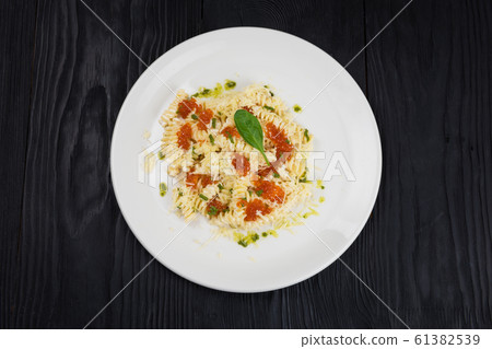 Pasta with red caviar 61382539