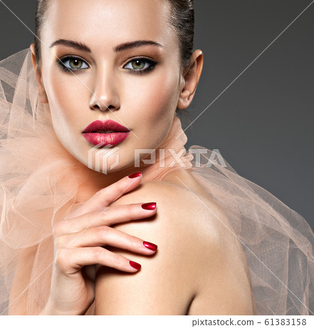 fashion woman with stylish makeup, red nails and 61383158