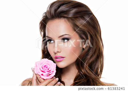 Face of a beautiful woman with long brown hairs Face of a beautiful woman with long brown hairs 61383241