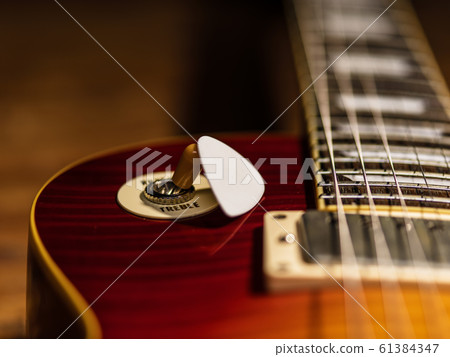 electric guitar body with mediator close-up view electric guitar body with mediator close-up view 61384347