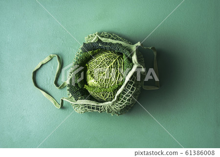 Savoy cabbage in eco-friendly fabric bag. Reusable Savoy cabbage in eco-friendly fabric bag. Reusable 61386008