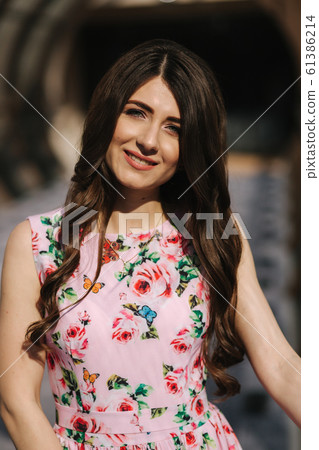 Portrait of beautiful young girl in flower dress with fashion makeup Portrait of beautiful young girl in flower dress with fashion makeup 61386214