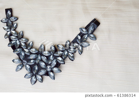 A female triangle-shaped necklace decorated A female triangle-shaped necklace decorated 61386314