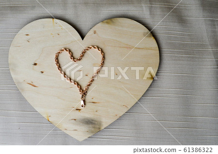 A heart made of a female gold chain A heart made of a female gold chain 61386322