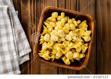 Italian stuffed pasta. Sacchettini pasta. Italian stuffed pasta. Sacchettini pasta. 61387117