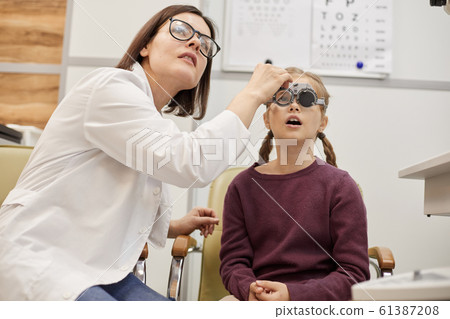 Little Girl at Vision Exam Little Girl at Vision Exam 61387208