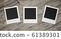 three square blank empty photocards on wooden background 3d render illustration 61389301