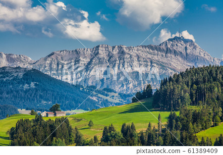 Idyllic landscape in the Swiss Alps with Saentis mountain, Appenzellerland, Switzerland 61389409