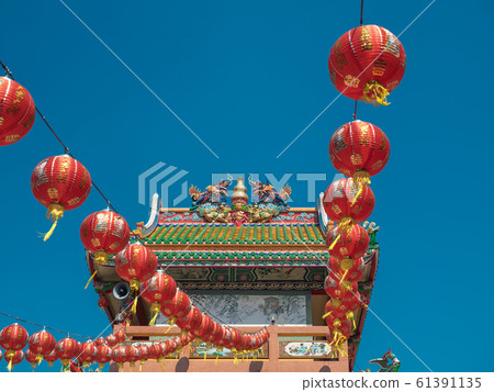 Sky blue have mask dragon demon monster icon red, green gold color on roof churches and temple and float lamp lanterns is happy chinese new year asia culture decoration shanghai and thailand buddhism 61391135