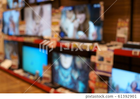 Blurred image of TV counter at electronics retail store 61392901