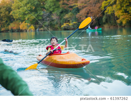 Children enjoying a canoe 61397262