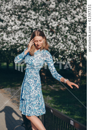 beautiful girl holding flowers. March 8: woman among flowers. the concept of congratulations, women's holidays, natural make up 61397331