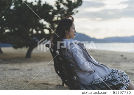 Evening sea woman 61397780