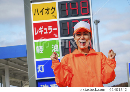 Woman working at gas station Woman working at gas station 61401842