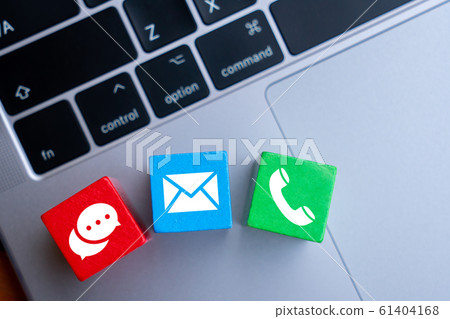 Contact us icon on colorful puzzle with hand 61404168