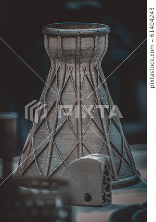 Man is holding object printed on metal 3d printer. Man is holding object printed on metal 3d printer. 61404243