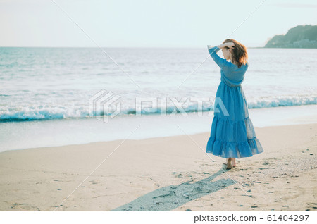 A woman in the sea 61404297