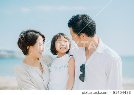 Family enjoying a sea bath 61404488