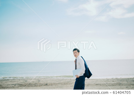 A man working at the sea A man working at the sea 61404705