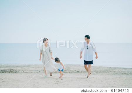 Family enjoying a sea bath 61404745