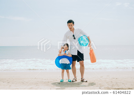 Family enjoying a sea bath 61404822