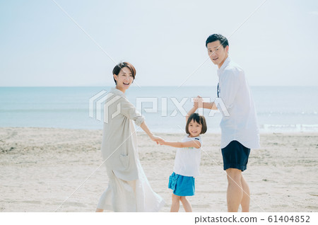 Family enjoying a sea bath 61404852