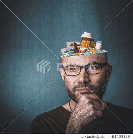 Portrait of man with pills in his head Portrait of man with pills in his head 61405159