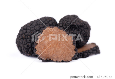 Black truffles isolated on a white background. Fresh sliced truffle. Delicacy exclusive truffle mushroom. Piquant and fragrant French delicacy. Clipping path. Black truffles isolated on a white background. Fresh sliced truffle. Delicacy exclusive truffle mushroom. Piquant and fragrant French delicacy. Clipping path. 61406078