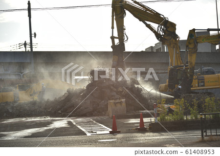 Large heavy machinery at the demolition site Concrete crusher 61408953