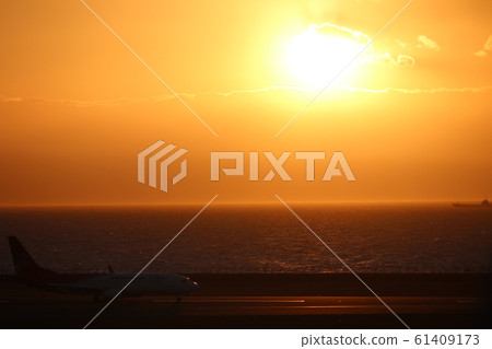Sunset and airplane Sunset and airplane 61409173