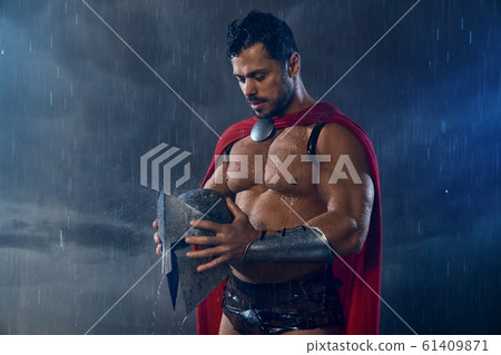 Muscular wet spartan in red cloak. 61409871