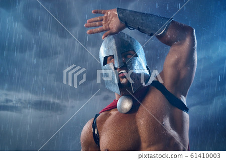 Spartan warrior getting wet in rain. Spartan warrior getting wet in rain. 61410003