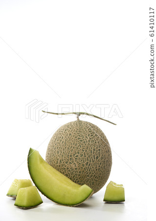 Fresh green melon and slice on white Fresh green melon and slice on white 61410117